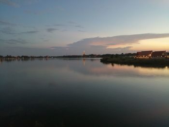 Scenic view of lake against sky at sunset