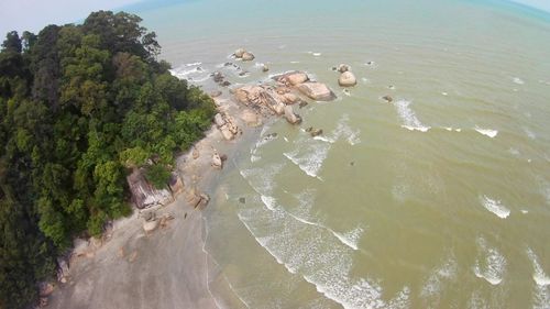 High angle view of birds on beach against sky