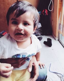 Portrait of cute baby girl at home