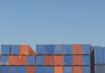 Stack of pier against clear blue sky