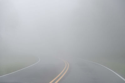 View of highway road amidst fog during winter