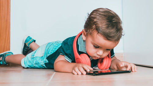 Portrait of boy on table at home