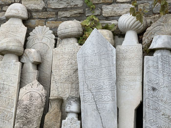 Close-up of ancient tombstone in fort cesme turkey