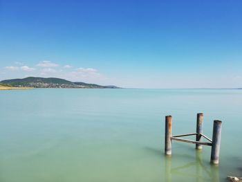 Scenic view of sea against blue sky