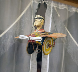 High angle view of toy hanging on wall