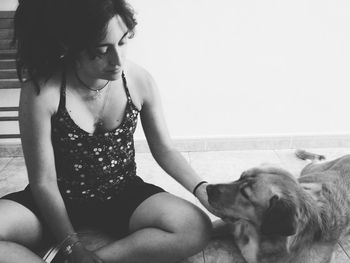 Rear view of woman with dog