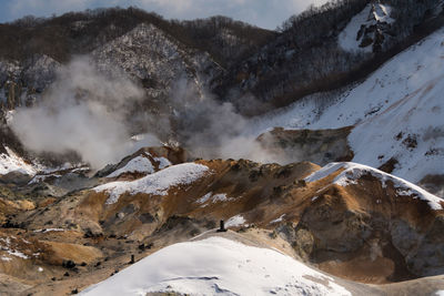 Scenic view of snow covered mountains