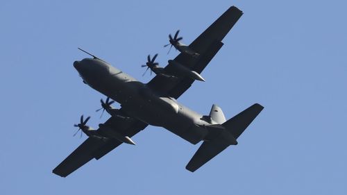 Low angle view of airplane against clear sky