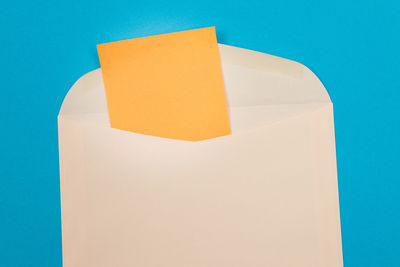 Close-up of paper against blue background