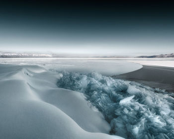 Scenic view of frozen sea against sky
