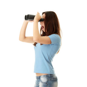 Woman photographing against white background