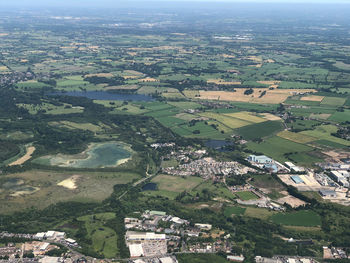 Aerial view of agricultural field by buildings