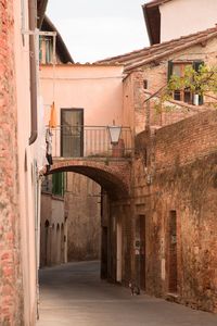 Alley amidst buildings in city