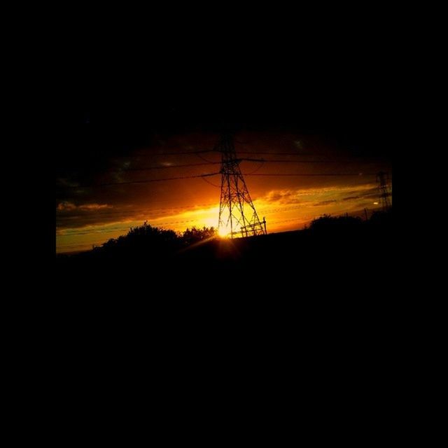 silhouette, sunset, electricity, power line, electricity pylon, power supply, fuel and power generation, sky, orange color, technology, connection, low angle view, dark, sun, nature, beauty in nature, tranquility, cable, scenics, tranquil scene