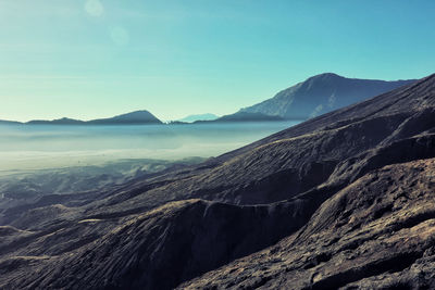 Scenic view of snowcapped mountains against clear sky