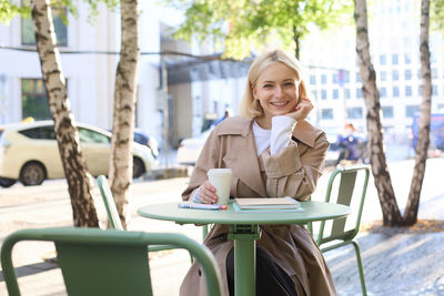 Young woman sitting on chair