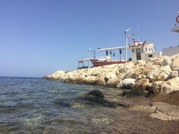 View of beach against clear sky