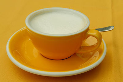 Close-up of coffee cup on table