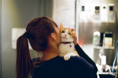 Woman with cat at home