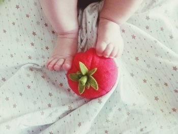 Midsection of woman holding fruit