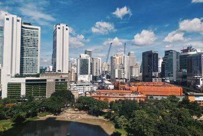 Modern buildings in city against sky