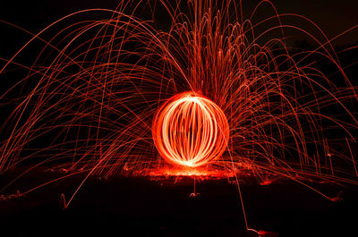 Light painting against sky at night