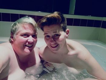 Portrait of smiling young woman in swimming pool