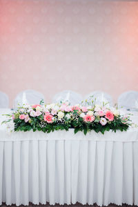 Close-up of pink flower pot against wall