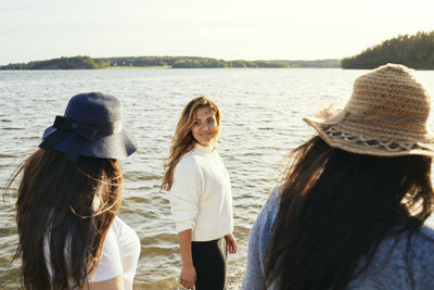 Female friends walking at sea