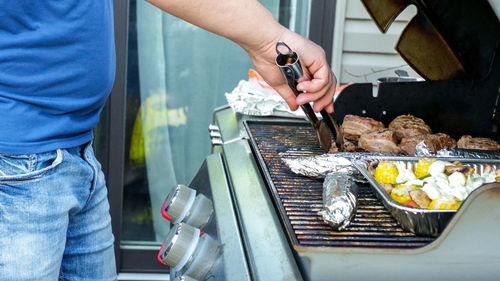 Midsection of man preparing food