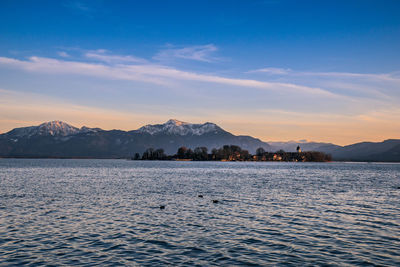 Scenic view of lake against sky during sunset