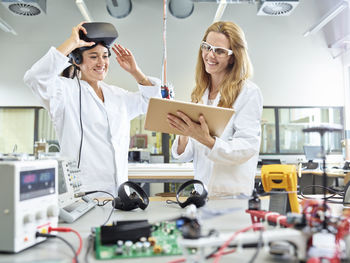 Female technicians working with tablet and vr glasses