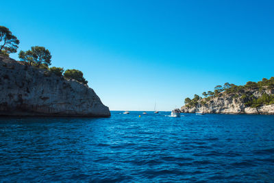 Scenic view of sea against clear blue sky