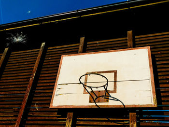 Low angle view of basketball hoop against sky