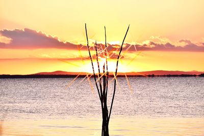 Dramatic sky over lake during sunset