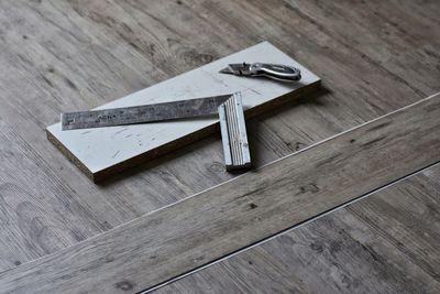 High angle view of old equipment on hardwood floor