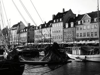 Boats moored at harbor