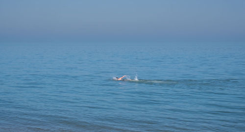 Scenic view of blue sea against sky