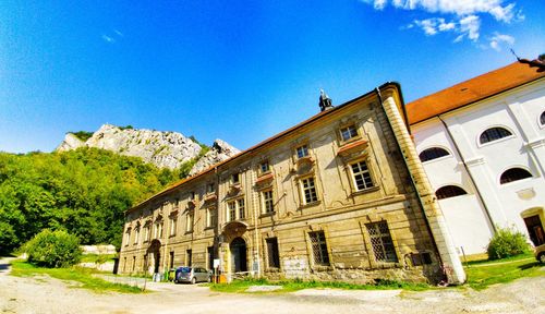 Low angle view of building against clear blue sky