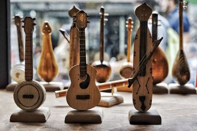 Close-up of wooden musical instruments for sale in market