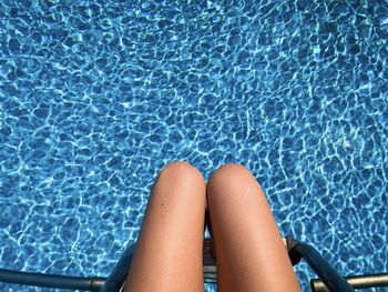 Low section of woman in swimming pool