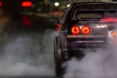 Close-up of car on road