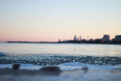 Scenic view of frozen lake against sky during sunset