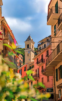 Buildings in city against sky