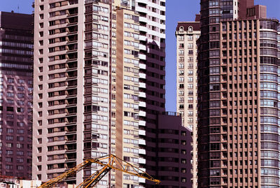 Framed view of modern buildings in financial district under sunlight