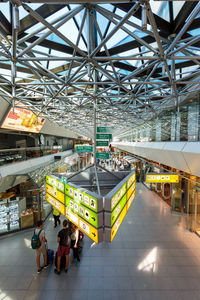 High angle view of people walking on railroad station