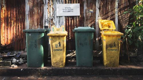 Garbage cans on roadside in city