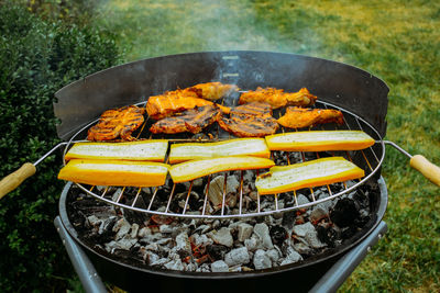 High angle view of meat on barbecue grill