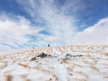 Scenic view of snow covered landscape against sky