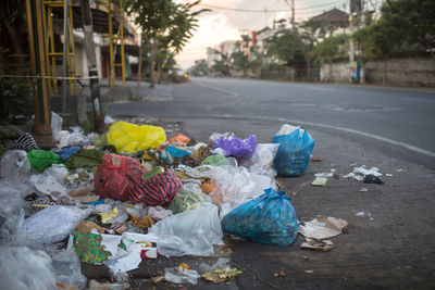 Trash thrown on the street.